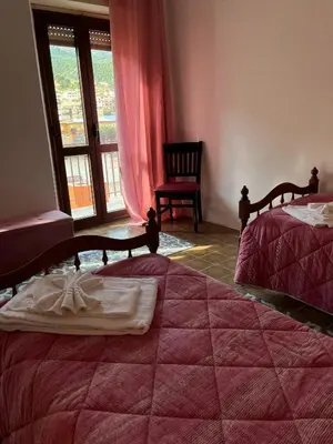 Letto o letti in una camera di Casa Meri