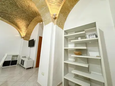 TV o dispositivi per l'intrattenimento presso Kalma Brick Arch Apartment - Central & Authentic