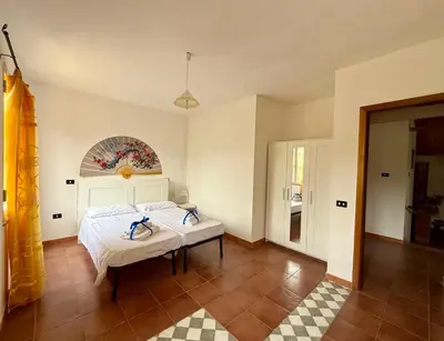 Letto o letti in una camera di Casa Fiorita