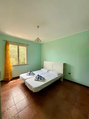 Letto o letti in una camera di Casa Fiorita