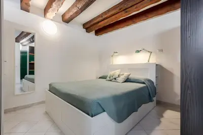 Letto o letti in una camera di GuestHost - Comfy Studio in the Heart of Cagliari