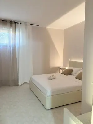 Letto o letti in una camera di Casa Tiepolo Villasimius