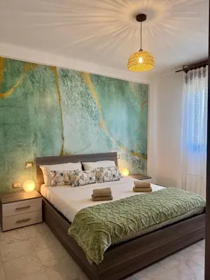 Letto o letti in una camera di Cagliari AirPort Apartment