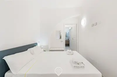Letto o letti in una camera di New St John Apt