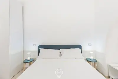 Letto o letti in una camera di New St John Apt