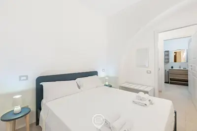 Letto o letti in una camera di New St John Apt