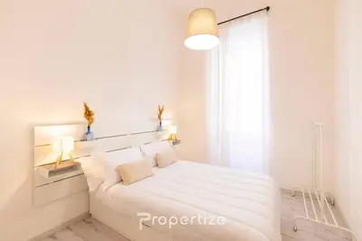 Letto o letti in una camera di Alchimìa by Propertize
