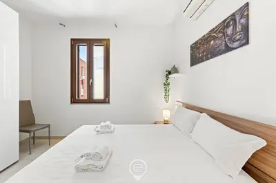 Letto o letti in una camera di Domus Karalitana