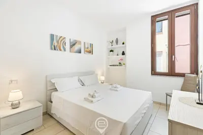 Letto o letti in una camera di Domus Karalitana