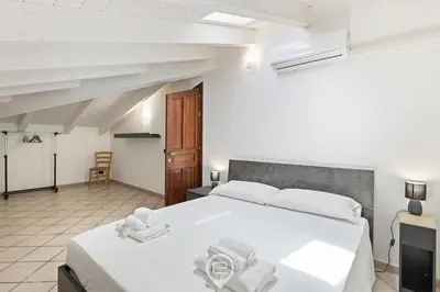 Letto o letti in una camera di The San Cosimo Loft
