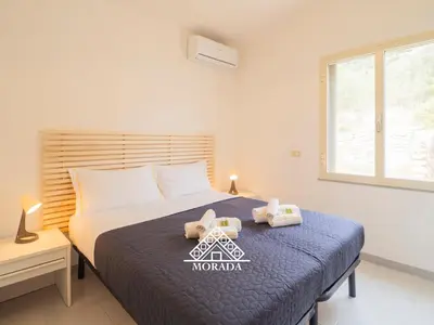 Letto o letti in una camera di Villa Arrubia - Morada