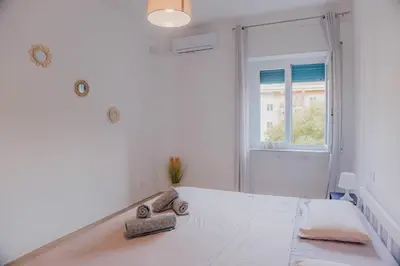 Letto o letti in una camera di Sunny apartment