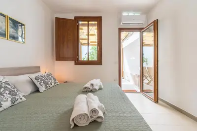 Letto o letti in una camera di La Casa dei Fiori d'Arancio