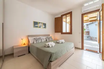 Letto o letti in una camera di La Casa dei Fiori d'Arancio
