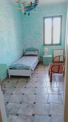 Letto o letti in una camera di Casa vacanze, Luciano