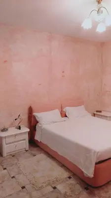 Letto o letti in una camera di Casa vacanze, Luciano