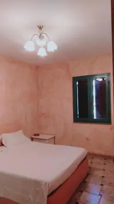 Letto o letti in una camera di Casa vacanze, Luciano