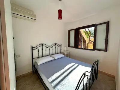Letto o letti in una camera di Palm house - seaside vacation home!