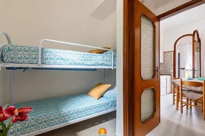 Letto o letti in una camera di Holiday House la terrazza