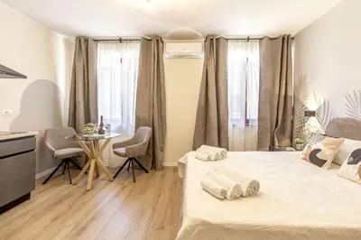 Letto o letti in una camera di Raighinas - Cozy Apartment Cagliari Center
