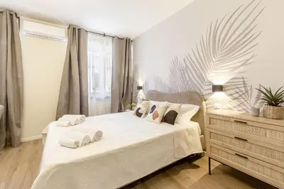 Letto o letti in una camera di Raighinas - Cozy Apartment Cagliari Center