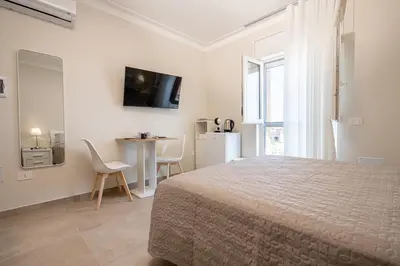 Letto o letti in una camera di ELEGANCE Calasetta's Rooms