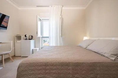 Letto o letti in una camera di ELEGANCE Calasetta's Rooms