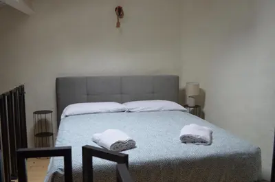 Letto o letti in una camera di La Taverna Iglesias