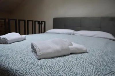 Letto o letti in una camera di La Taverna Iglesias