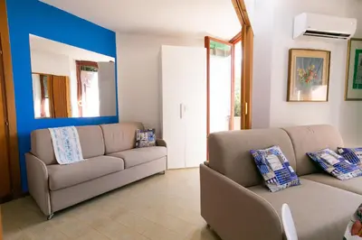 Area soggiorno di Teulada cozy flat with pool and beach access