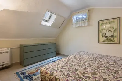 Letto o letti in una camera di GuestHost - Villino Stella