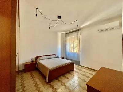 Letto o letti in una camera di Villa Cocca