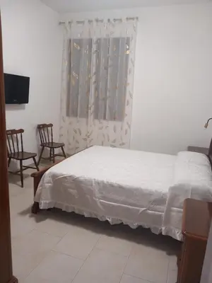 Letto o letti in una camera di Casa Maria