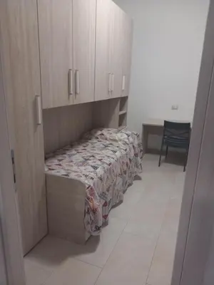 Letto o letti in una camera di Casa Maria