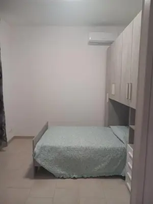Letto o letti in una camera di Casa Maria