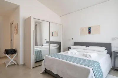 Letto o letti in una camera di I Centenari Longevity Rooms