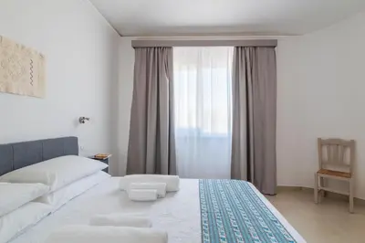 Letto o letti in una camera di I Centenari Longevity Rooms