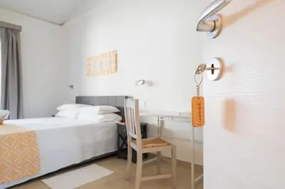 Letto o letti in una camera di I Centenari Longevity Rooms