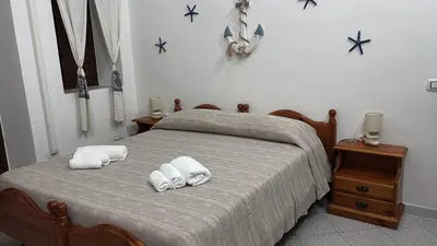Letto o letti in una camera di Domo via Ozieri