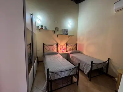 Letto o letti in una camera di Sa Domu Arrosada