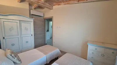 Letto o letti in una camera di Su Chélu