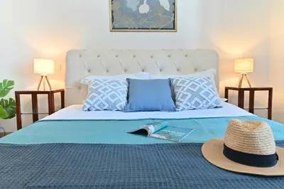 Letto o letti in una camera di IzzHome Gallery