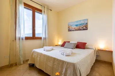 Letto o letti in una camera di Pascoli Apartment - Pula