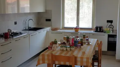 Cucina o angolo cottura di B&B Blueberry via Capri Porto Frailis