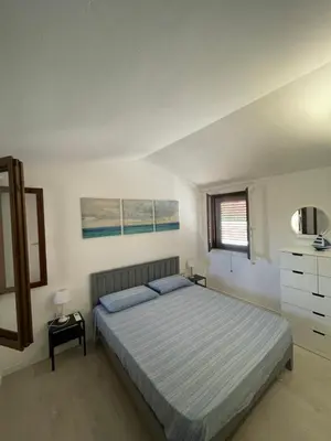 Letto o letti in una camera di Sabbiamare Relax e Mare
