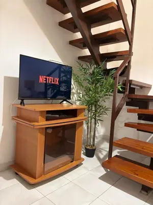 TV o dispositivi per l'intrattenimento presso Mandorleto Relax House - House with a view and garden
