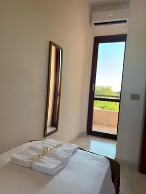 Letto o letti in una camera di Mandorleto Relax House - House with a view and garden