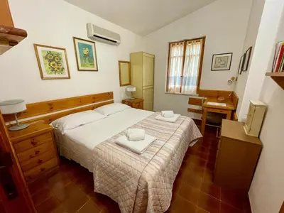 Letto o letti in una camera di Villa Marina
