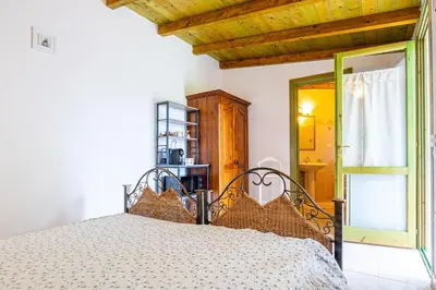 Letto o letti in una camera di Monolocale Elena
