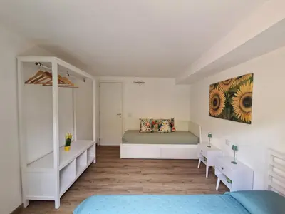 Letto o letti in una camera di Casa Felicita Garden Porto Frailis